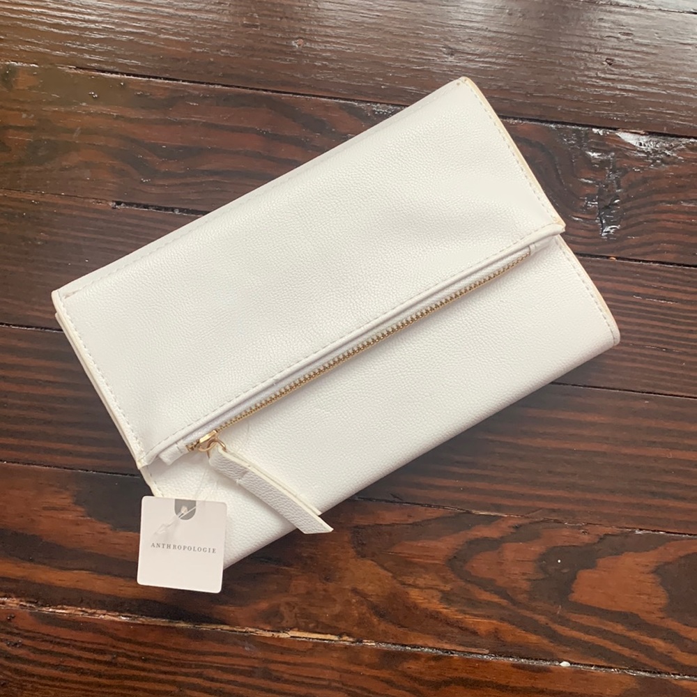 Clutch/notebook with multiple pockets. New with tags.